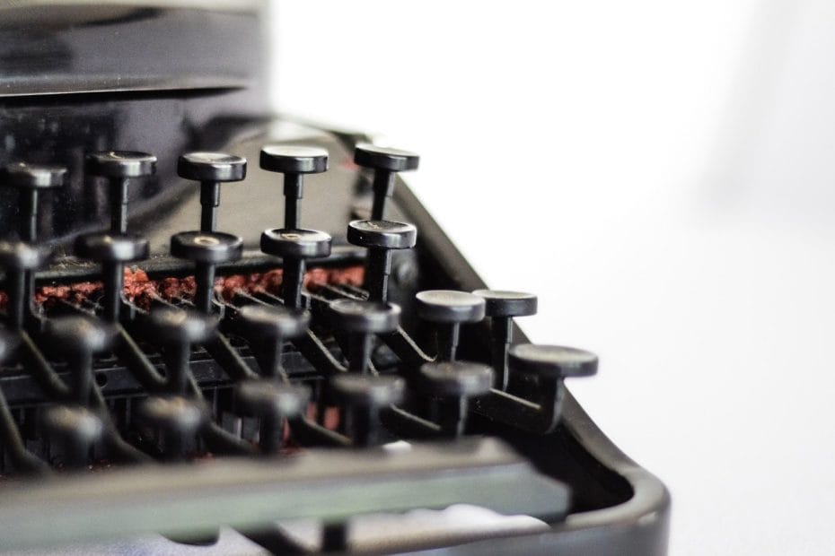selective focus photography of typewriter keys